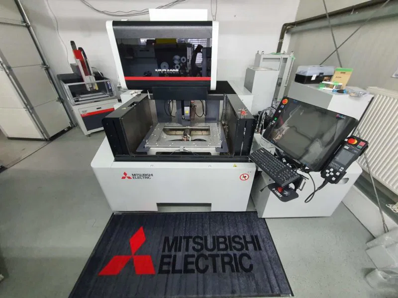 Mitsubishi Electric machine in a modern industrial setting, equipped with advanced controls and display interface.